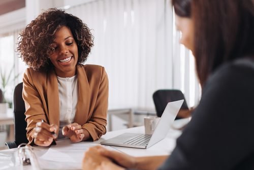 Female client consulting with a agent in the office